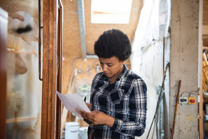 woman reviewing kitchen remodel project