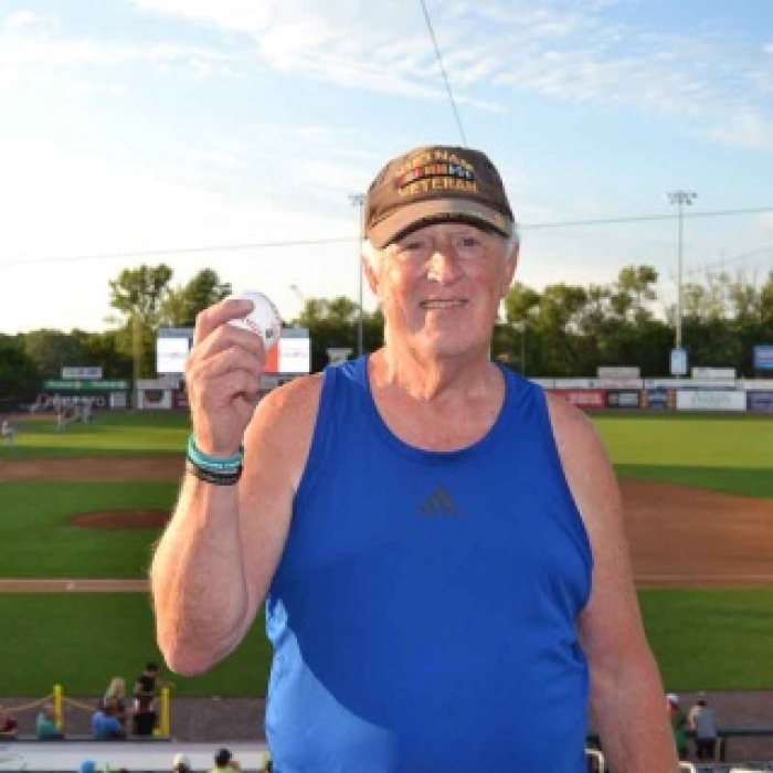 Jim Keyes holding a baseball